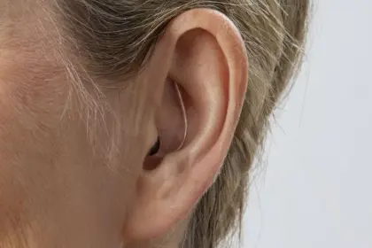 Oticon Zeal nxt CIC H2 2025 Angle F45 Close up In On Ear MS1487 Woman