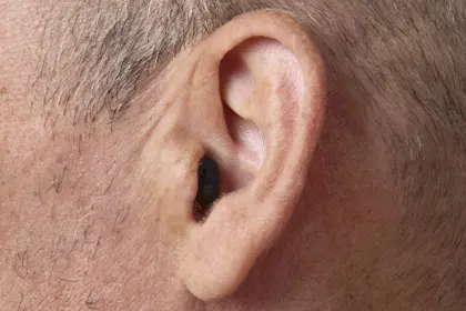 Oticon Zeal nxt CIC H2 2025 Angle90 Close up In On Ear MS1607 Man